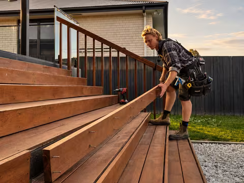A timber deck with a balustrade rail